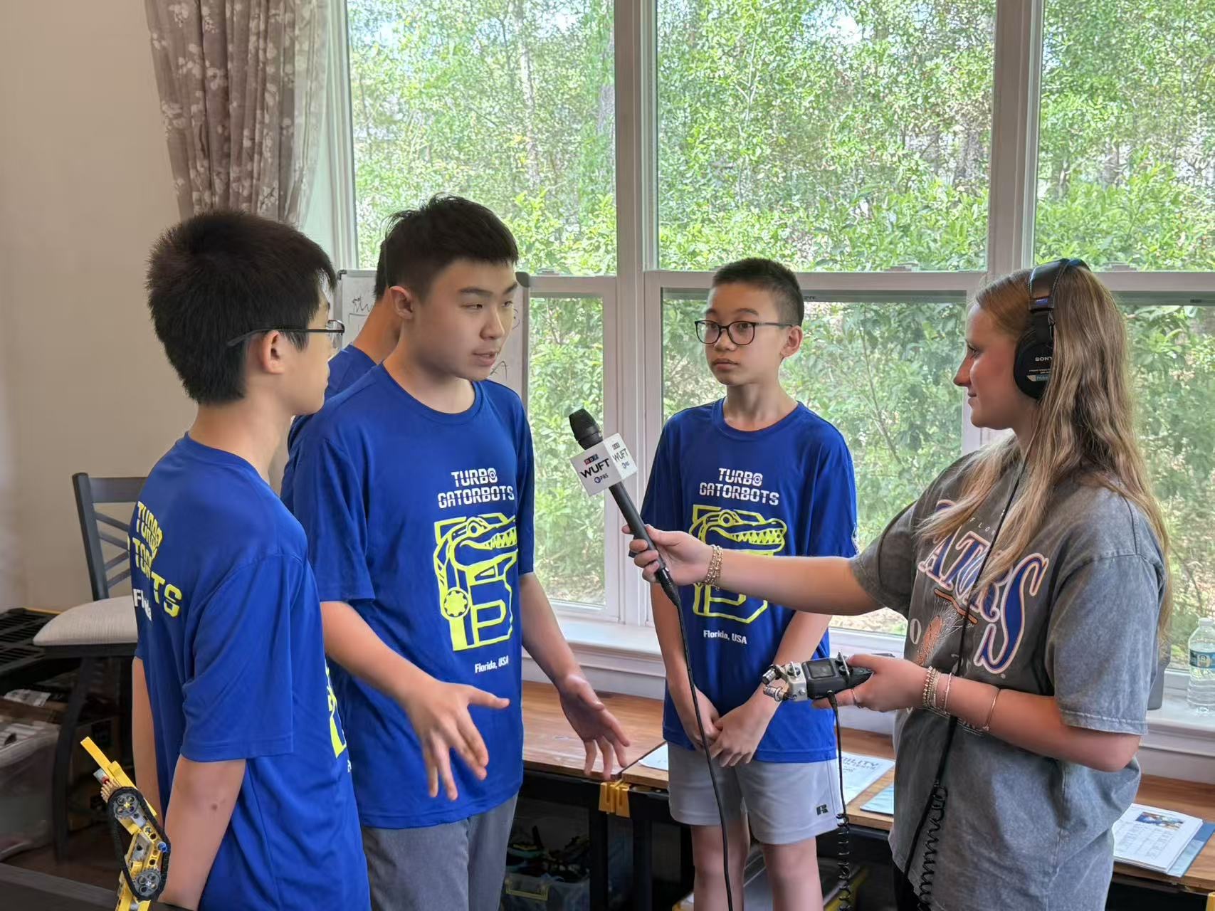 Turbo Gatorbots team members speaking during a media interview