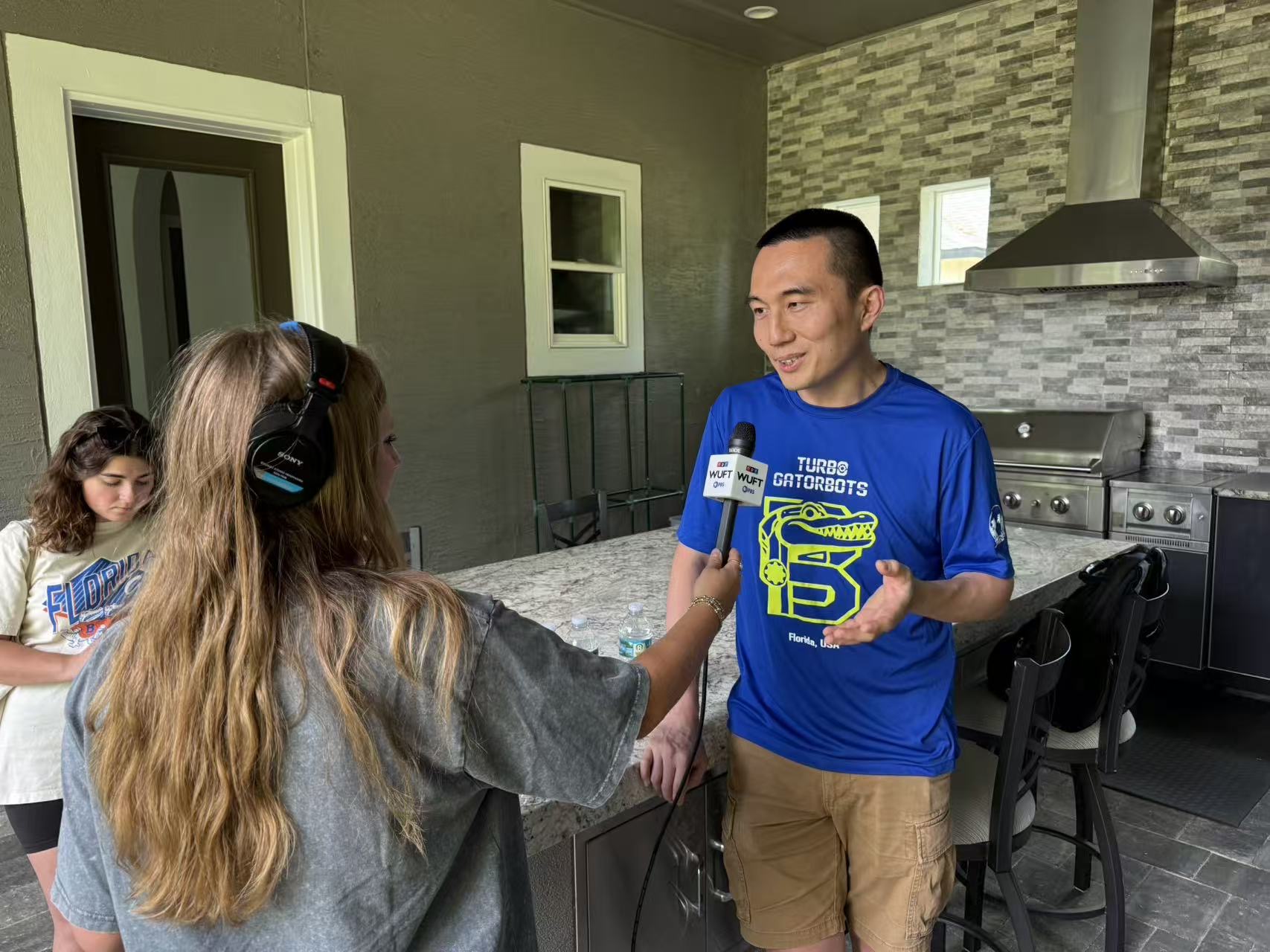 A coach or mentor being interviewed about Turbo Gatorbots